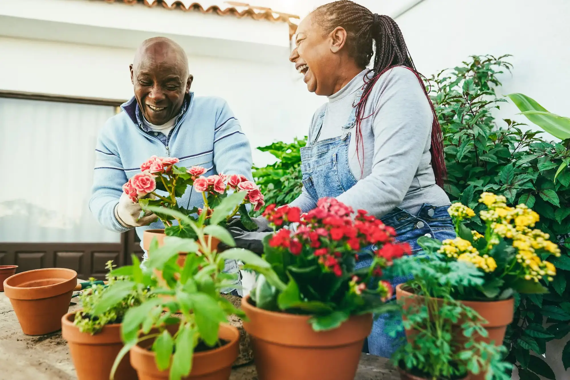 best social clubs for seniors blog 1 An elderly couple gardening in assisted living at Charter Senior Living of Bay City, one of the best clubs for seniors with limited mobility.
